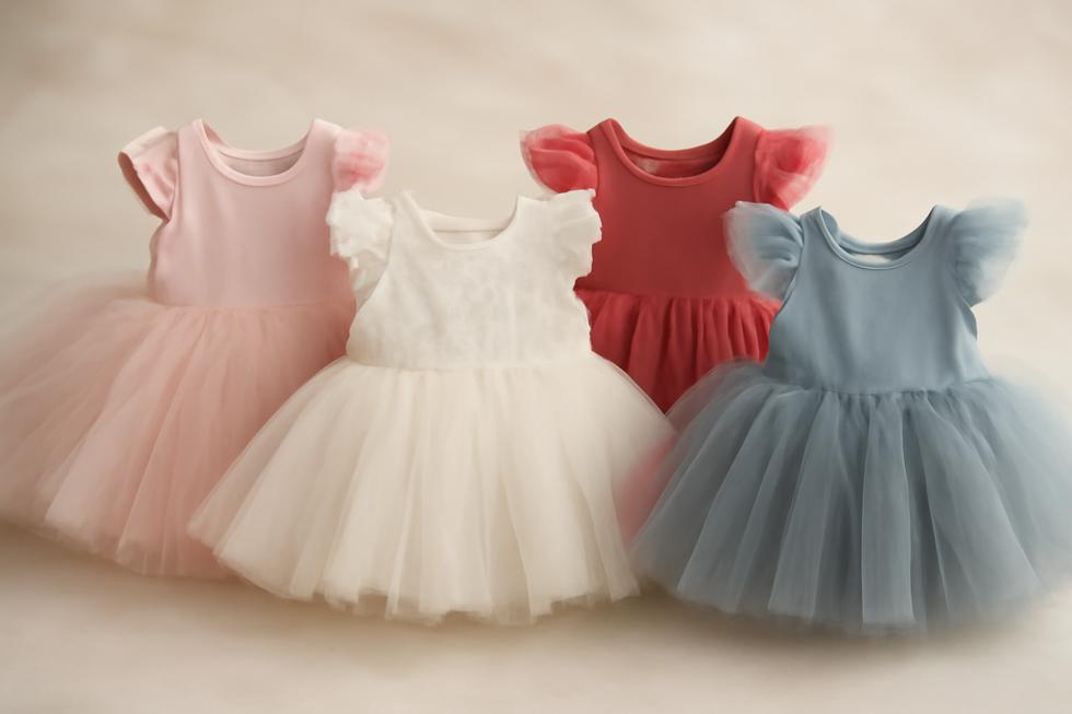 Colorful baby tutu dresses arranged together, highlighting their fluffy tulle and inviting designs.