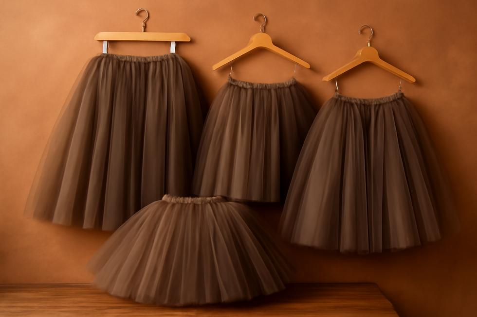 An array of brown tutus in various styles and lengths beautifully displayed.