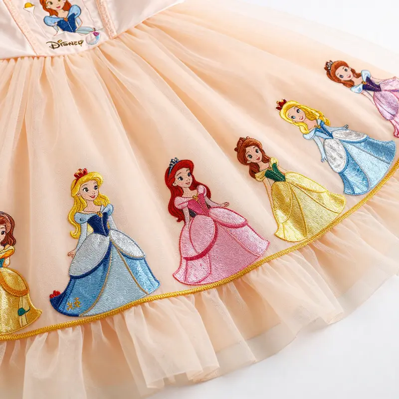A joyful young girl exhibits the comfort of a Disney Princess Tutu Dress as she twirls in a bright park.