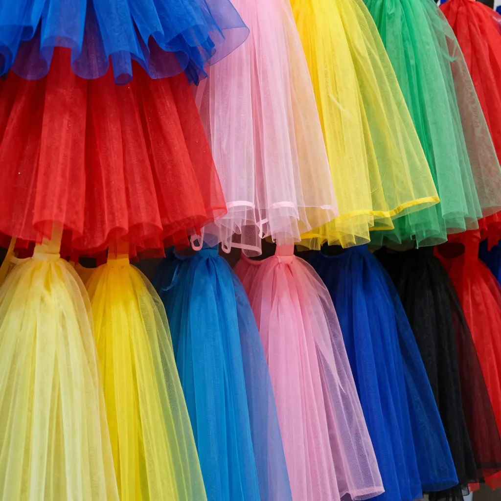 Colorful display of clown tutus showcasing different fabrics